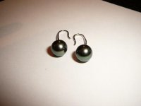 Tahitian pearl earrings laid flat