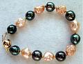 Kamoka Black Tahitians With Rich Apricot Rosebud Freshwater Pearls