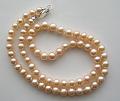 Off-round peach freshwater pearl necklace.