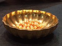 cynde's golds in a gold dish