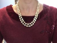 two cream colored rosebud/drusy strands from Catherine Cardellini on burgundy sweater