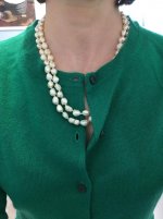 Cream Rosebud pearls on green sweater