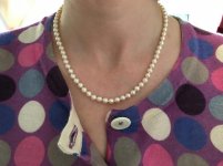 The pearls are about 6mm and the strand length 18 with fish hook clasp