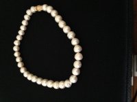 Selling pearls on sale