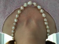 Catherine Cardellini ripple pearls on neck