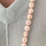 Close up wearing cream freshwater pearl rosebud rope from Lilia's Treasures