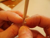 Apply pressure with index finger nails to shape wire hook.jpg