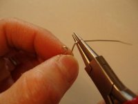 Close up of bending wire with round nose pliers.jpg