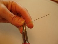 Bracing hook with middle finger, use index finger to force wire over pliers.jpg