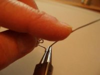 pinch hook and push wire back over pliers with index finger.jpg