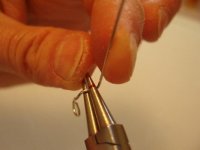 Use left index finger to curve wire around pliers at mark.jpg