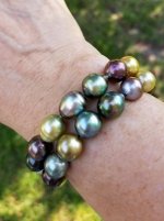 Wearing two Fiji pearl bracelets from Pearl Paradise