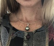 a big, simple green Tahitian pearl pendant