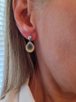 wearing little h SSP and blue diamond earrings