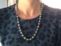 Wearing Tahitian pearls with blue shirt.JPG