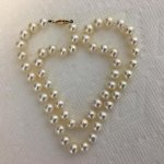  The strand is 18 and the pearls in it are 7-7.5mm Pearl Paradise metallic white strand