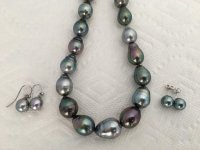 the studs are 10-11mm round Tahitians from Golay and the dangles are roughly 10mm Tahitian drops from Pearl Paradise