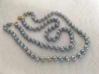 Double strand of blue baroque akoya from Pearl Paradise laid flat