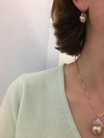 Wearing fireball pendant and earrings