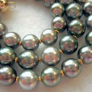 Close Up Of Kamoka Pearls Charcoal, Silver Black Tahitians