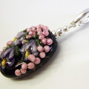 Midnight Garden.
Hand made lampwork glass with sterling silver accents and silver enhancer bale.