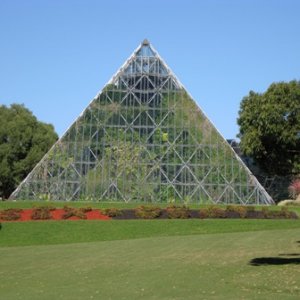 Funky pyramid that says "Sex and Death" underneath, in the topiary.