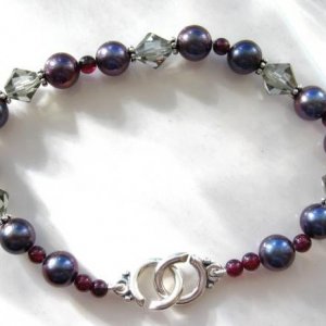 TPO 7mm black FW bracelet with garnets and smokey Swarovski crystals.