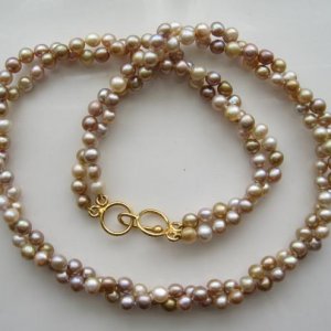 One of my favorites.  Tiny natural color freshwater pearls.