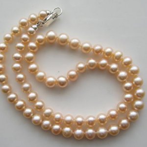 Off-round peach freshwater pearl necklace.