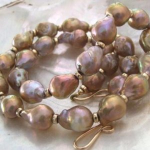 Golden purple fireballs from Kojima pearl I strung into a necklace. It goes with everything I wear!