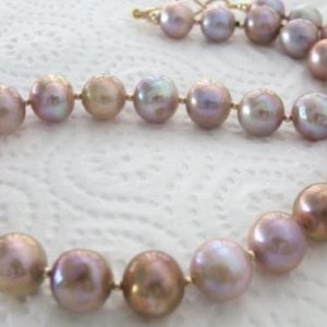 Large golden purple pondslime necklace - boy do I LOVE this one, 19inch, graduated from 10-13mm. Some pearls have swirling colours of coffee cream with purple and gold.