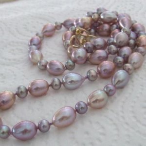 Purple drips and drops with small baroques necklace. 30inch, drips and drops 12x8mm, small 5mm. I can't resist looking down at the purply pink overtones!