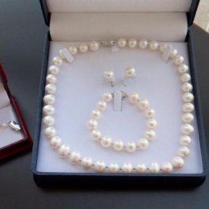 Added 7 new pearls to this necklace today - pearls about 12mm Freshwater HK - silver clasp with base metal bottom