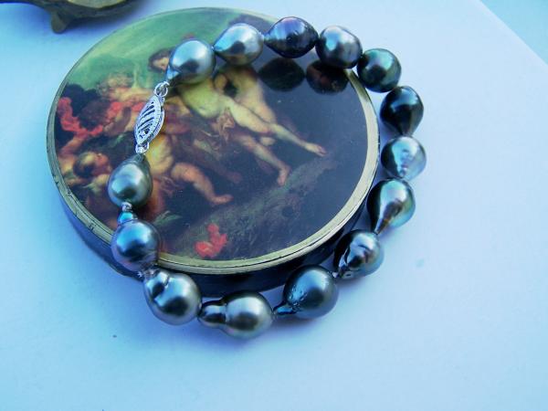 A very colorful, very unique drop and baroque Tahitian pearl bracelet.  One of the pearls is actually pink and purple.