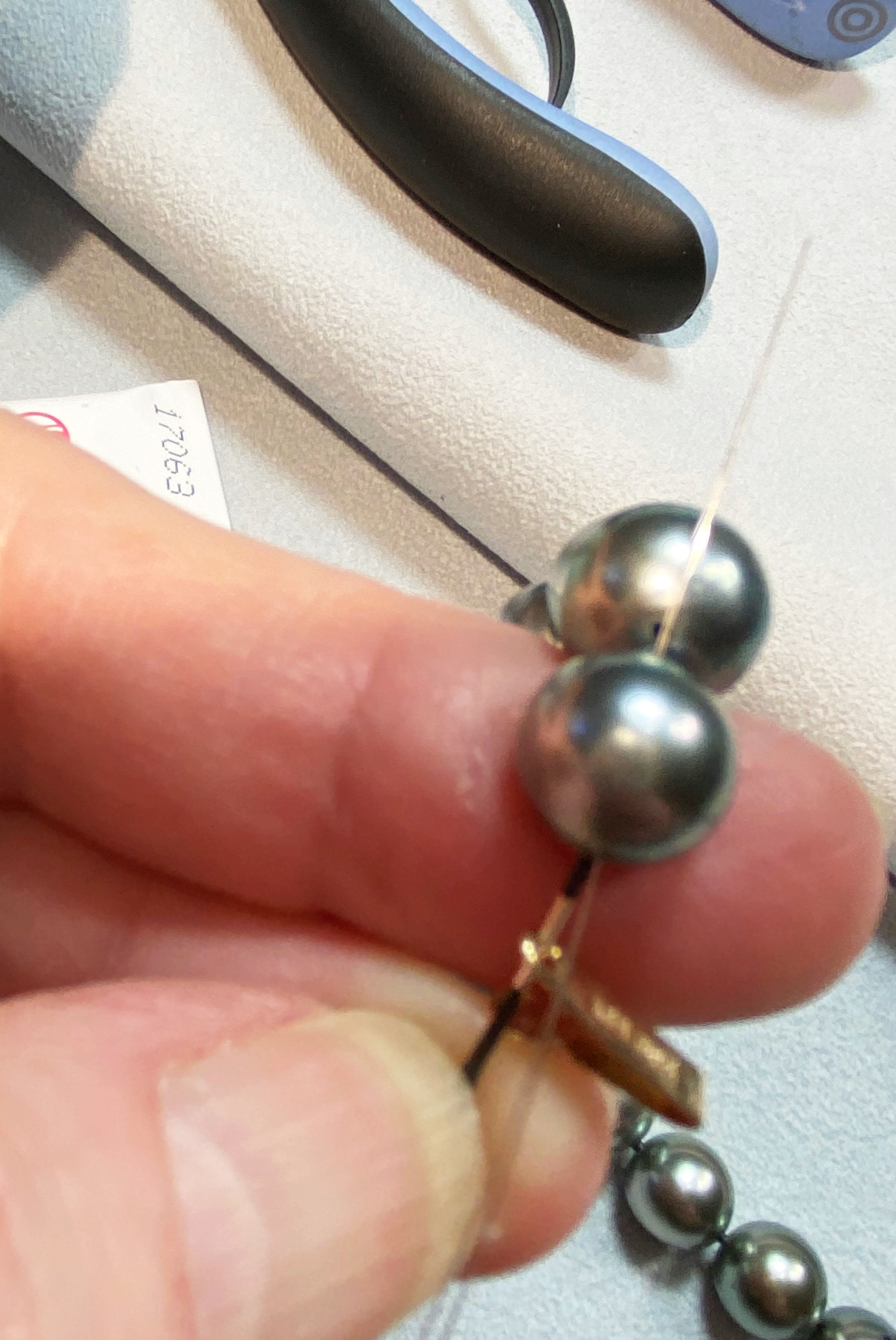 Clasp tongue is added, holding it taut over my finger.  Next is the fussy part.  Lay the piece on the work surface.