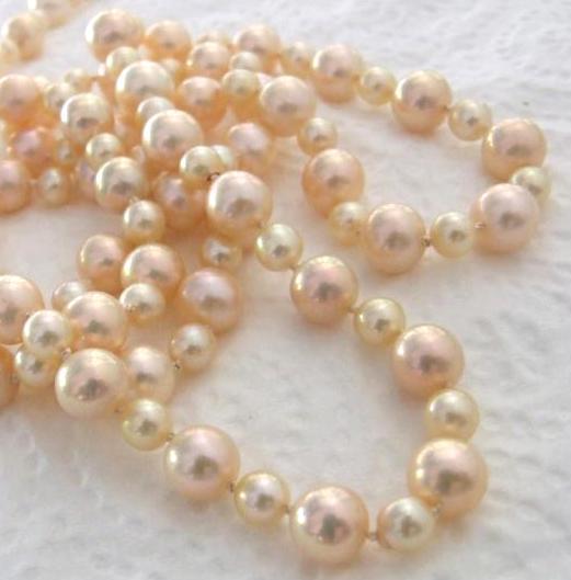 My Old Akoya with Golden Apricots. I bought my akoyas about 30 years ago and don't wear them any more. So I've restrung them with 10mm golden apricot almost round freshwater pearls. Its maybe 36 inches long now, with matching earrings. I wore them to the Christmas party 2008.