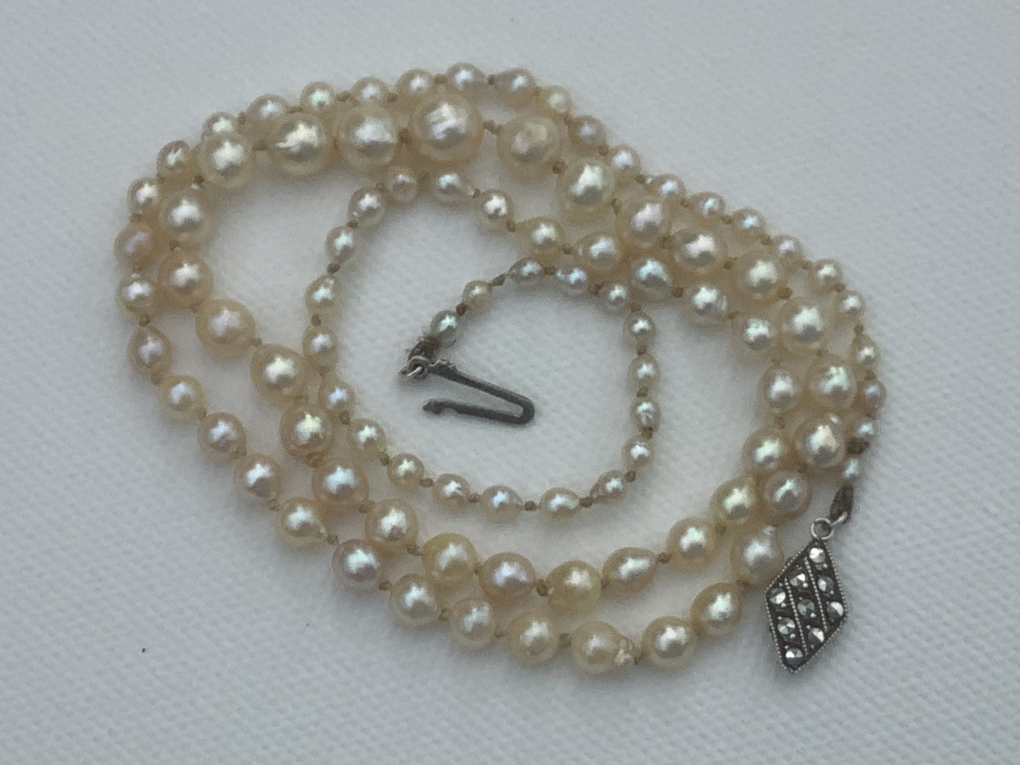 Pearl strand is 22” long,largest pearl1/4inch,or 11mm