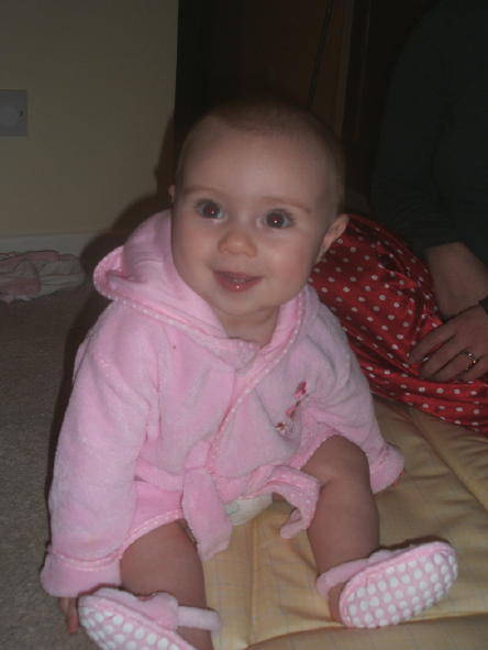 Six and a half months old and sitting up on her own, albeit a little wobbly.